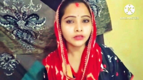 Beautiful Indian woman in red saree and traditional attire, smiling for hot homemade stepfamily video