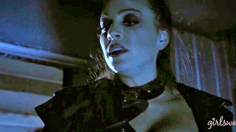 April O'Neil in leather collar, intense gaze in Wastelands lesbian fantasy