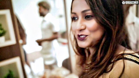 Indian adult star in elegant saree smiling seductively in behind-the-scenes clip