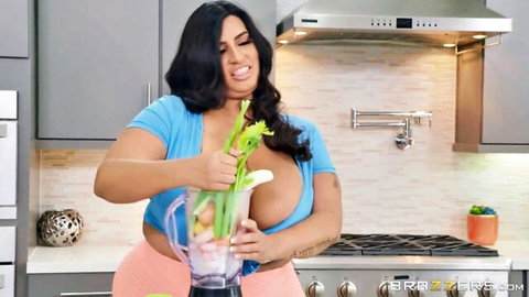 Sofia Rose's massive cleavage spilling from blue top while blending veggies