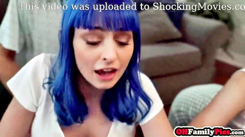 Jewelz Blu with blue hair in steamy threesome, mouth open in ecstasy