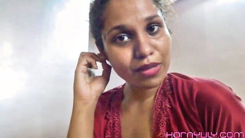 Seductive Indian desi babe in red lingerie, teasing with earring touch