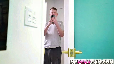 Stepbro takes selfie in bathroom doorway, teasing family taboo with blonde milf stepsister