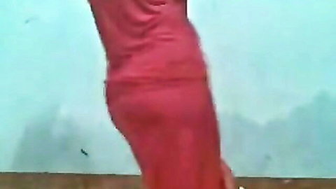 Sexy Arab babe in tight red dress showing off her juicy ass and curves from side view