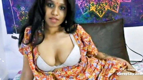 Horny Lily sexy Indian babe teases deep cleavage tits in white bra open floral robe