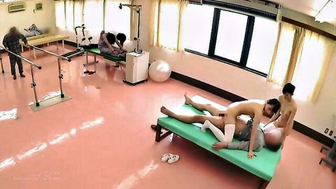 Japanese babe in rehab uniform rides hard dick in therapy session