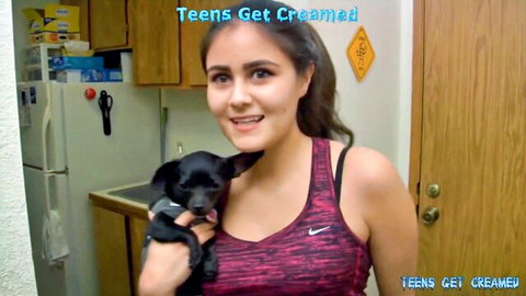 Cute Hispanic teen Andaisy in pink sports bra holding puppy