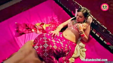 Indian brunette babe in pink saree lies on bed as thick cock rubs her exposed pussy