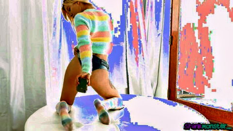 Petite blonde in striped sweater squats teasing small ass in tight shorts and colorful socks