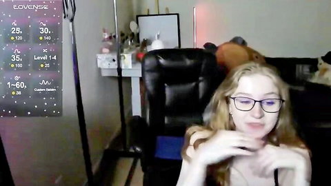 Blonde webcam girl with glasses smiles in daddy domination stream