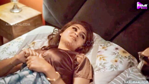 Aroused Indian woman in erotic bed scene, traditional attire