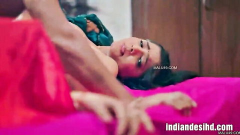 Busty Indian Bhabhi in steamy bed scene with big boobs and intimate touch
