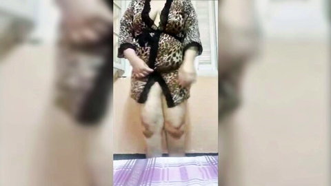 Mature Algerian mom Niyaka Skhouna in open leopard robe, teasing pose