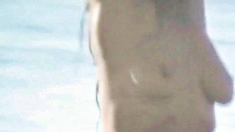 Naked wife doing side yoga pose on sunny beach, slim body exposed