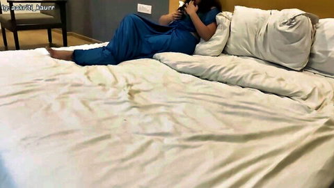 Desi stepsister in blue salwar on bed, teasing in amateur OYO video