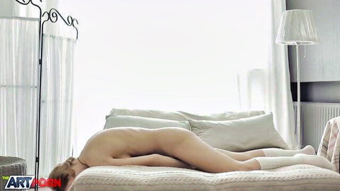 Blonde bombshell Berta nude on bed, seductive solo pose