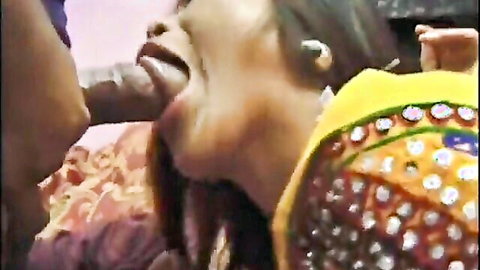 Indian woman in embroidered sari sucking thick veiny cock with stretched lips