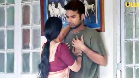 Passionate Indian MILF in saree embraces young man in erotic scene