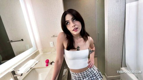 Chanel Camryn teases in white crop top and plaid skirt by sink with toy