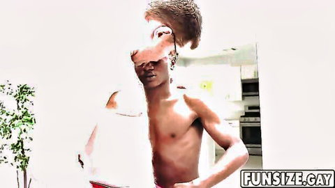 Sexy shirtless ebony twink posing with towel in bathroom mirror
