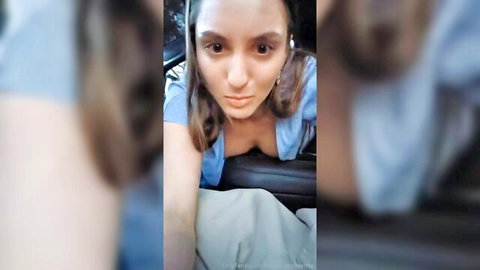 Bailey Lucky teasing cleavage in low-cut blue top car selfie