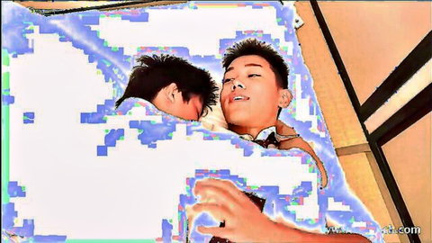 Intimate embrace of two young Asian men in bed, one moaning bottom teasing tight ass