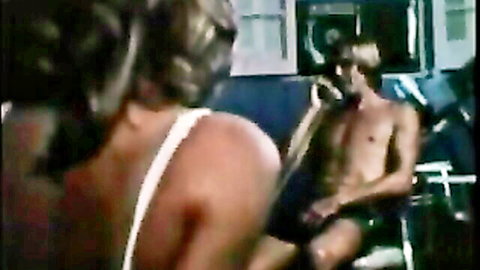 Bunny Bleu in white dress seducing shirtless hunk on phone, retro scene