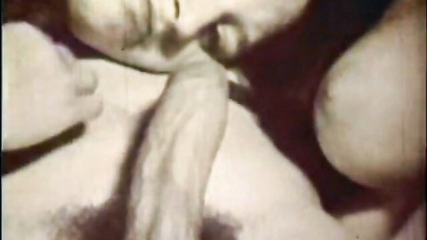 Vintage black and white retro porn thumbnail of woman giving oral sex with big tits exposed
