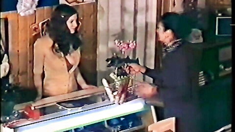 Vintage Private scene: young brunette receives flowers from mature woman in seductive exchange