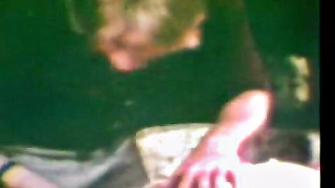 Vintage threesome thumbnail: blurry close-up of woman in historic erotica with perky tits