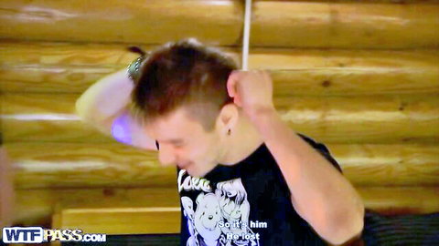 Excited guy in black tee at wild college party, ready for sexy dances