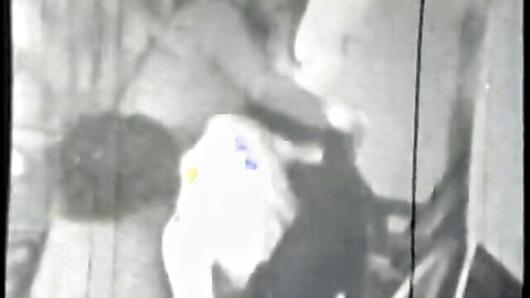 Retro CFNM hotel room scene with unknown model in white dress