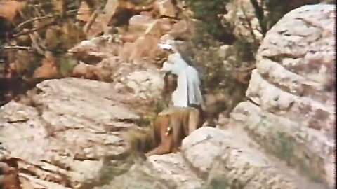 Vintage outdoor roleplay with seductive white woman in blouse amid rocks