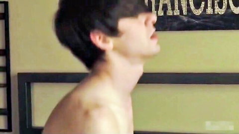 Young shirtless emo twink arches neck with mouth open moaning in ecstasy