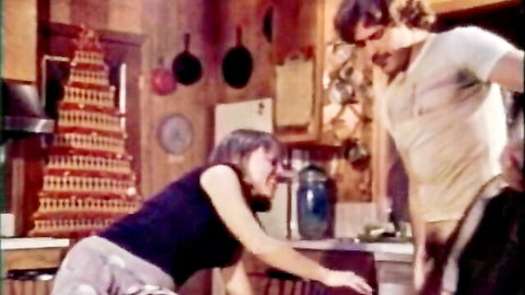 Vintage Swedish babe bending over in tank top, teasing hairy ass in classic kitchen scene
