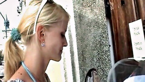 Blonde amateur woman in ponytail at outdoor picnic scene