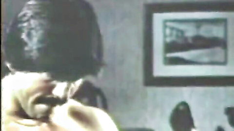 Retro teen with long dark hair in intense oral scene, vintage erotica thumbnail