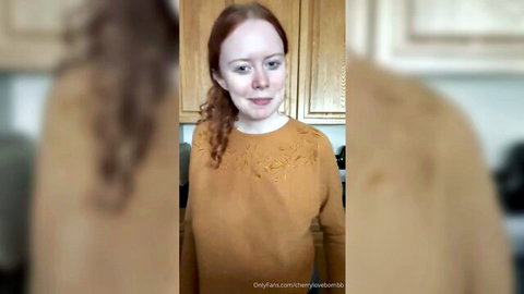 Petite redhead with ponytail in sweater for solo JOI tease