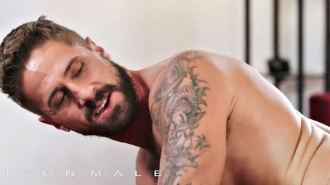 Wesley Woods moaning in ecstasy, tattooed muscular man in gay sex scene