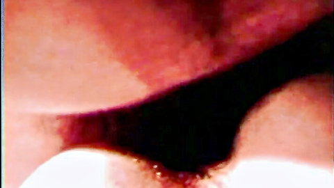 Vintage close-up of woman's spread vulva sliding on banister