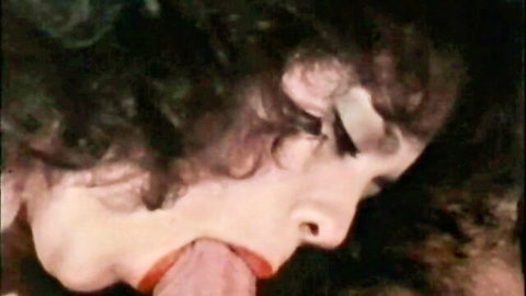Tina Marie giving blowjob to Ron Jeremy in vintage milf sex scene