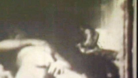 Vintage black and white lesbian doggystyle with natural tits