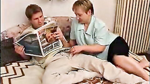 Short-haired Russian mom strokes friend's cock while reading newspaper