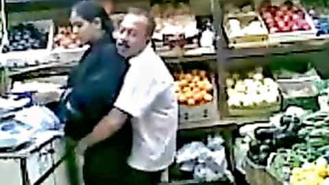 South Asian woman bent over grocery counter as man grinds behind her in amateur tease