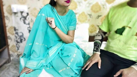 Punjabi stepmom in turquoise saree with tattooed man on bed, Indian couple tease