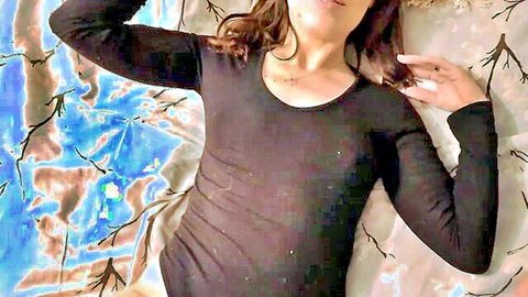 POV seductive brunette stepmom in black top lying on bed
