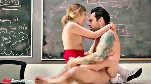 Coco Lovelock petite blonde cheerleader topless on tattooed man's lap