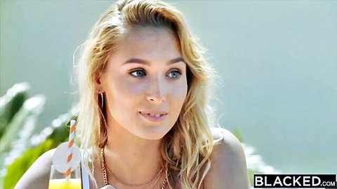 Sexy blonde sipping orange cocktail outdoors showing cleavage for Blacked.com
