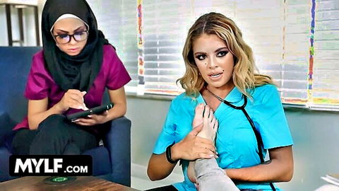 Busty MILF Doctor Vivianne DeSilva and hijab-wearing assistant Bianca Bangs in medical exam