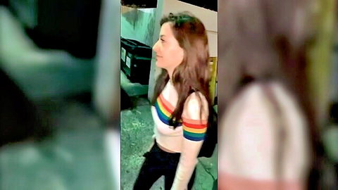 Natalie Brooks in striped sweater behind dumpster, outdoor tease